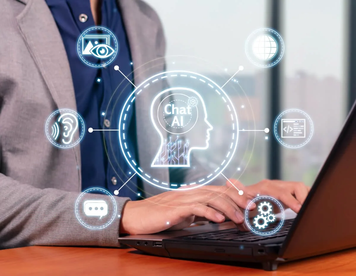 AI chat automation hologram displayed above a laptop keyboard representing intelligent workflow management.